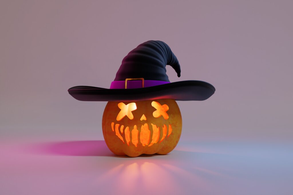 Halloween pumpkin wearing a witches hat