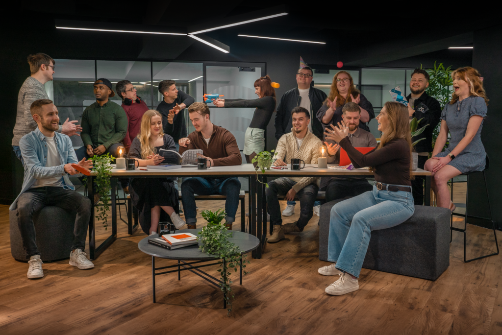 The Create8 brand and web team sat around a table having fun