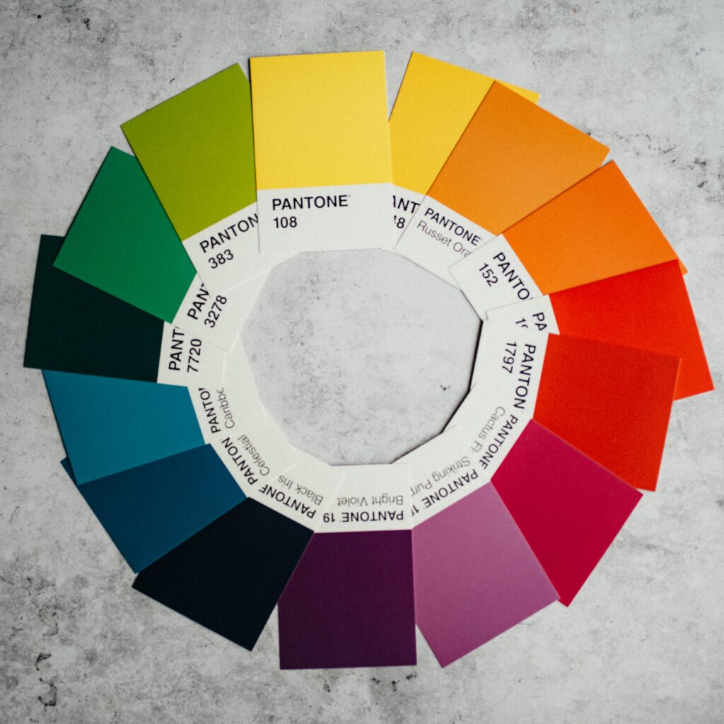 Various Pantone swatches laid out in a colour wheel 