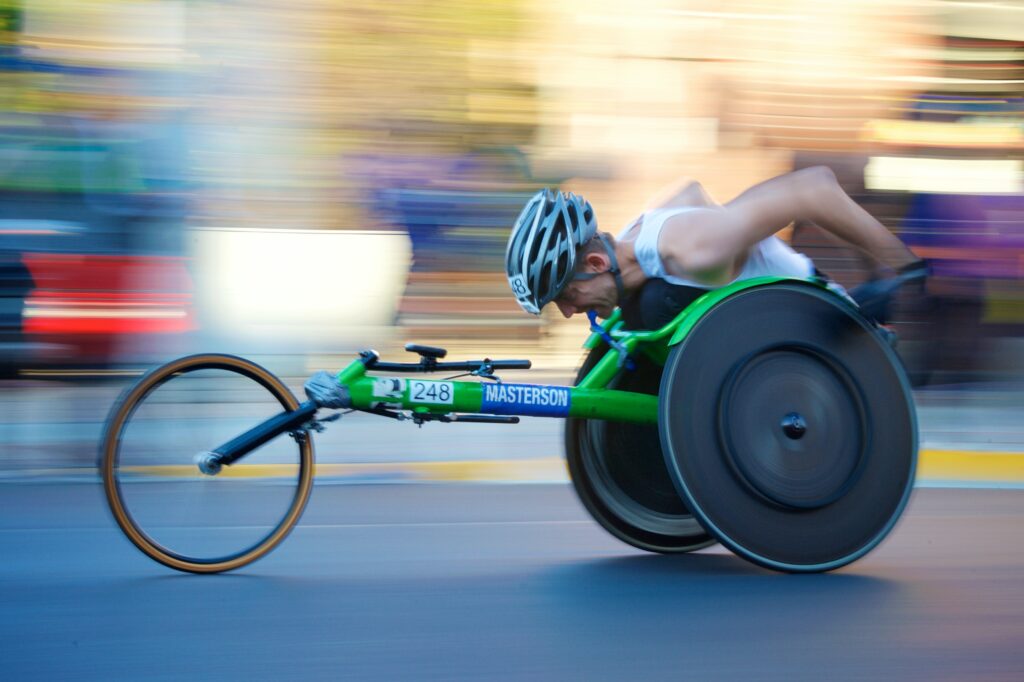 disabled athlete using a wheelchair bicycle