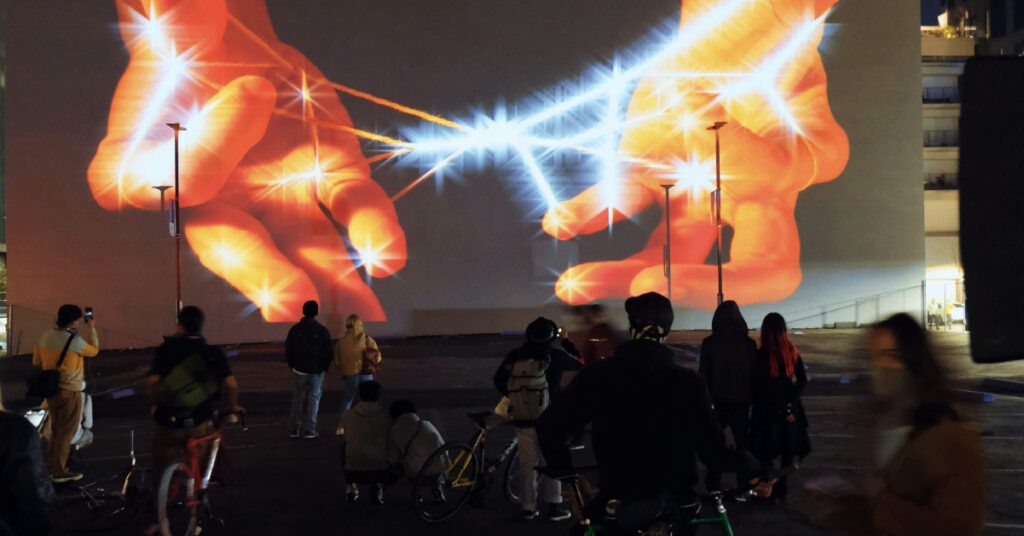 Hands displayed on an interactive video