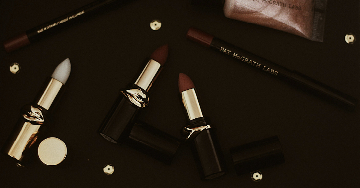 Dark and moody product photography of makeup items