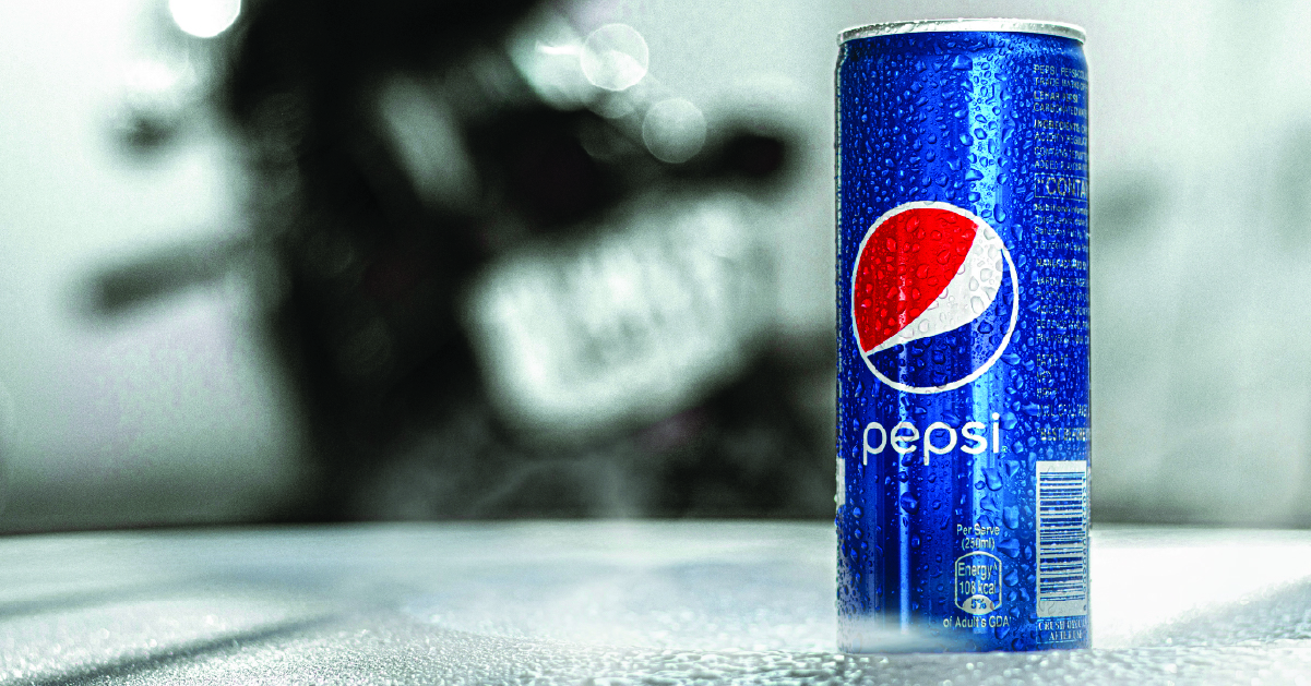 A Pepsi can on a marble table