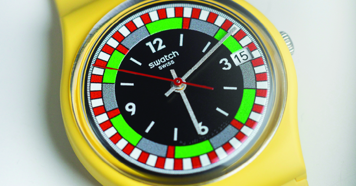 A close up shot of a Swatch watch face
