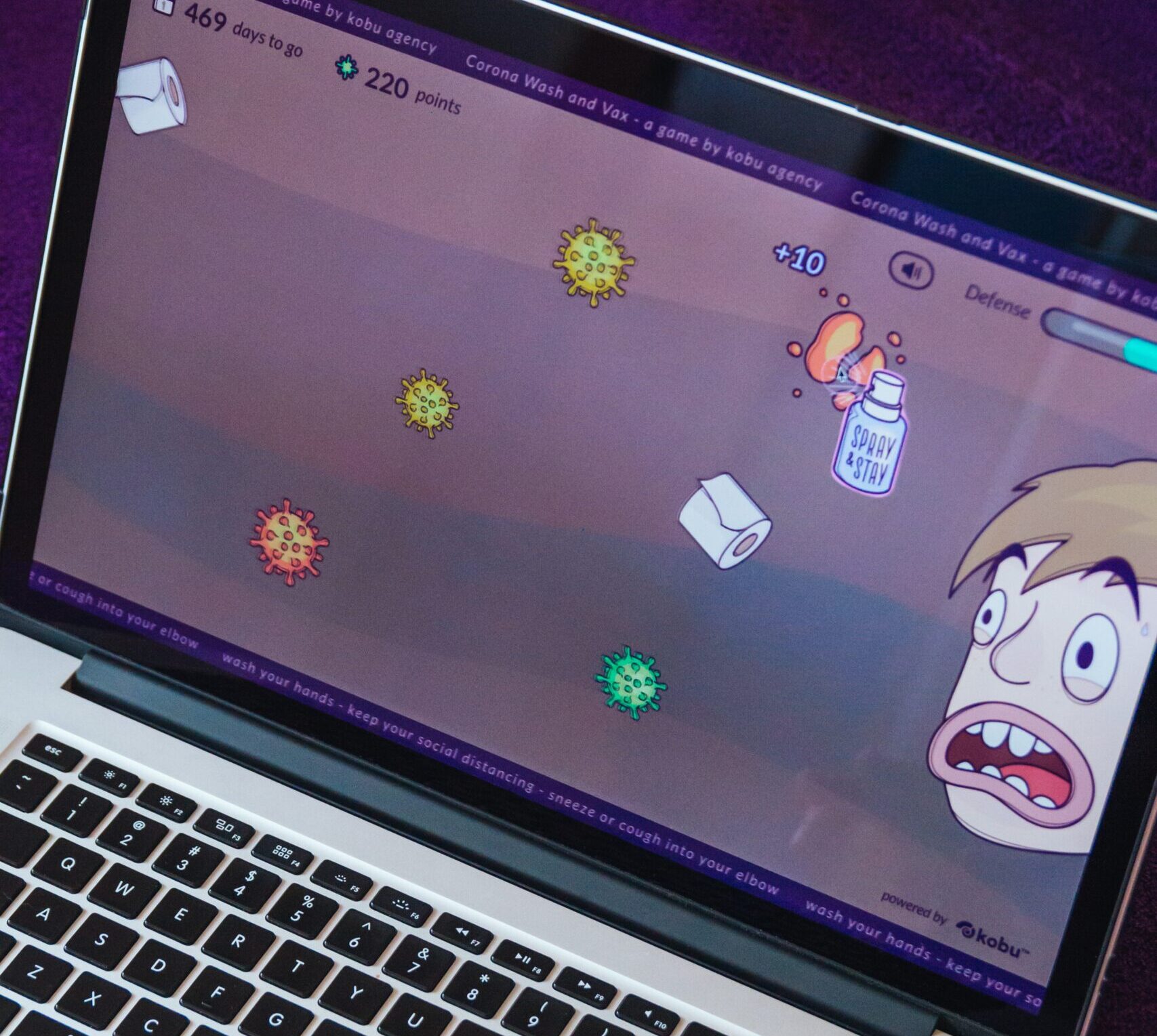 computer virus shown as cartoons on a laptop computer