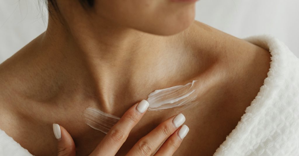 woman applying lotion