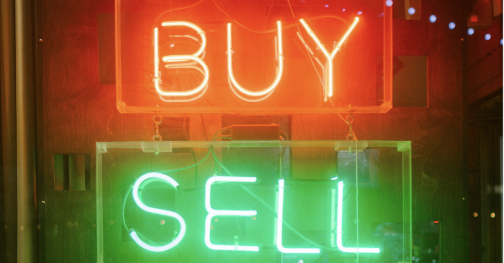 Neon sign, showing Buy / Sell