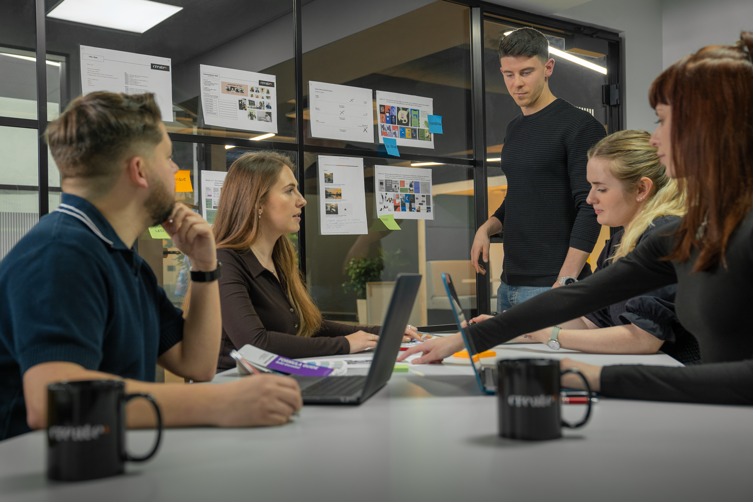 Create8 Brand and Web team discussing a project