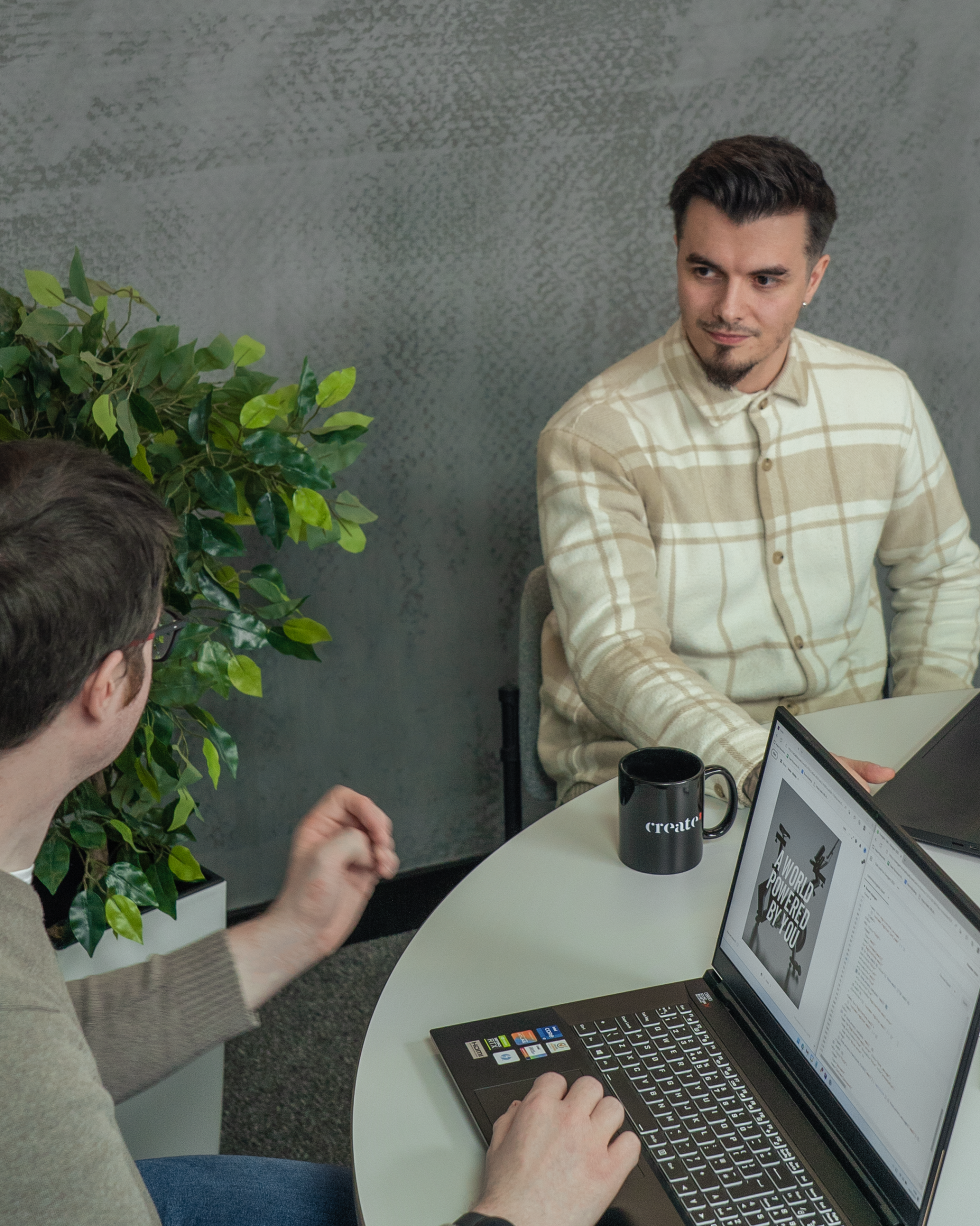 Create8 WordPress developers working around a desk