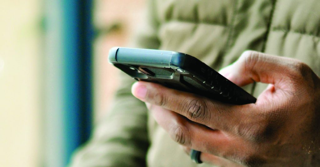 A man browsing on his mobile phone