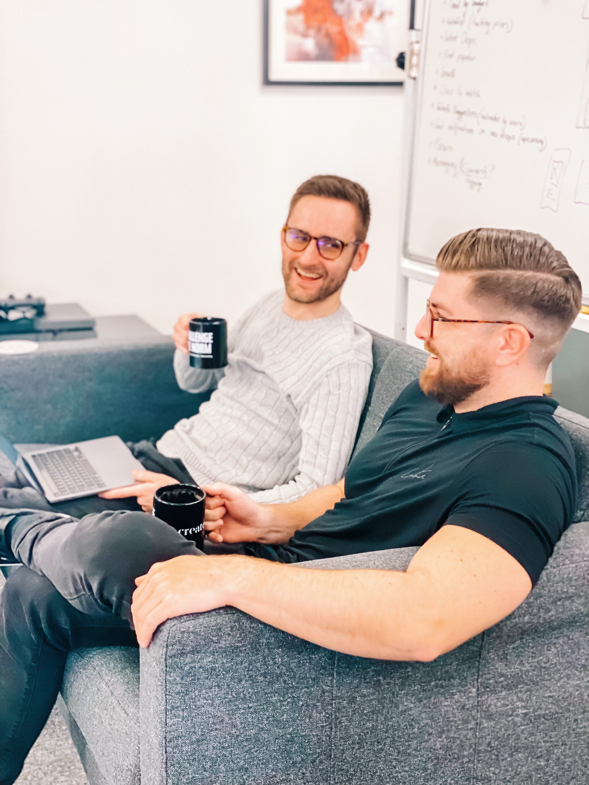 Create8 eCommerce experts sat on a sofa