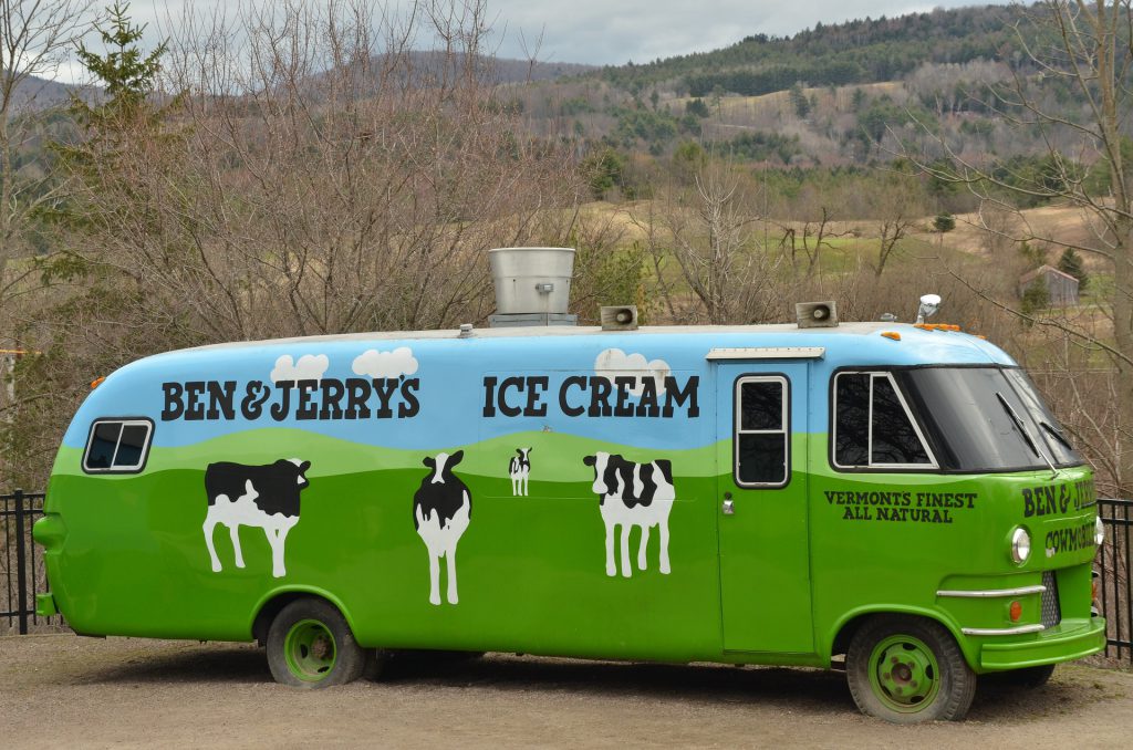 An oldfashioned bus that says Ben&Jerry's Ice Cream on the side