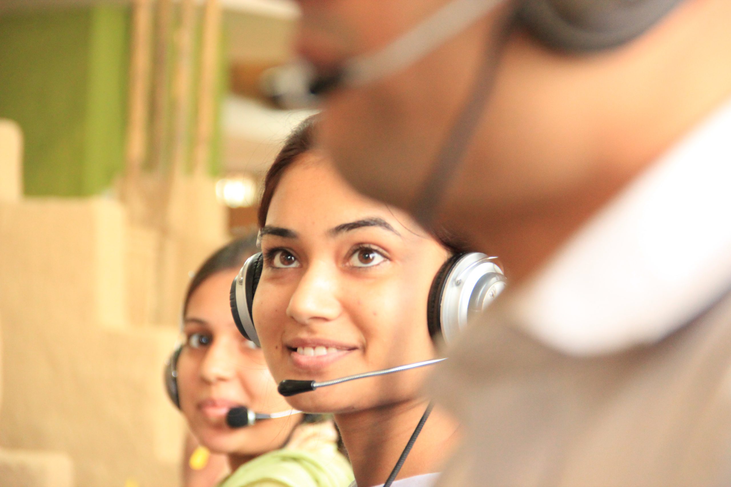 woman working in a customer service role wearing a headset
