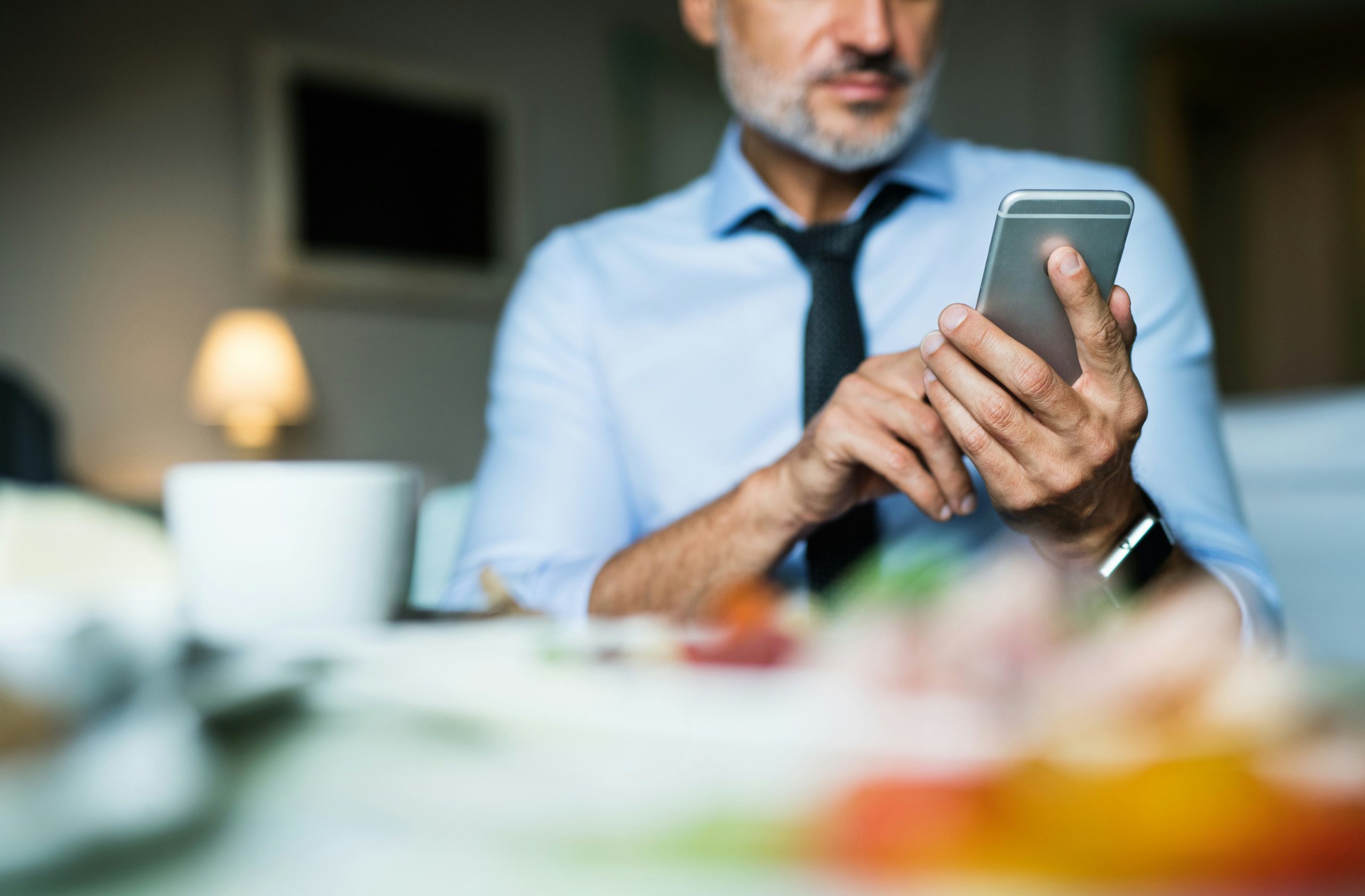 Man booking an appointment on his phone