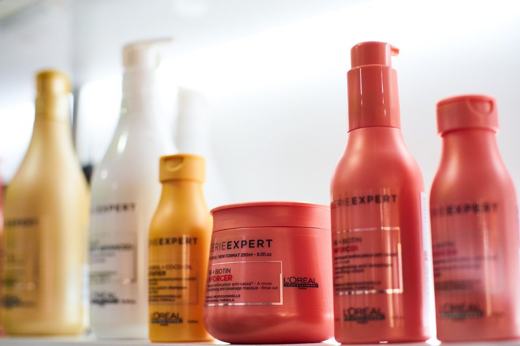 red and yellow bottles of haircare products