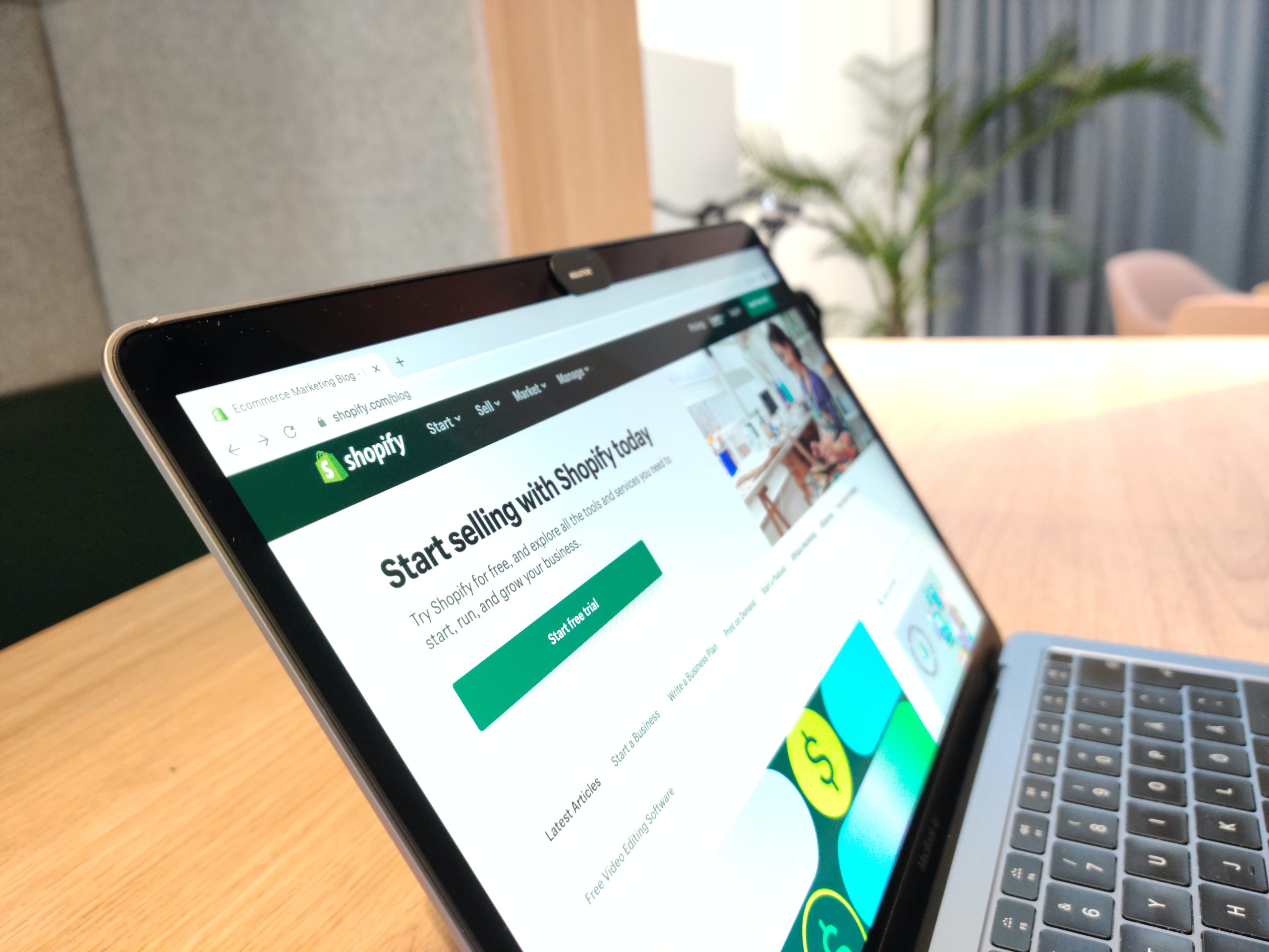 "Start selling on Shopify" shown on a laptop computer