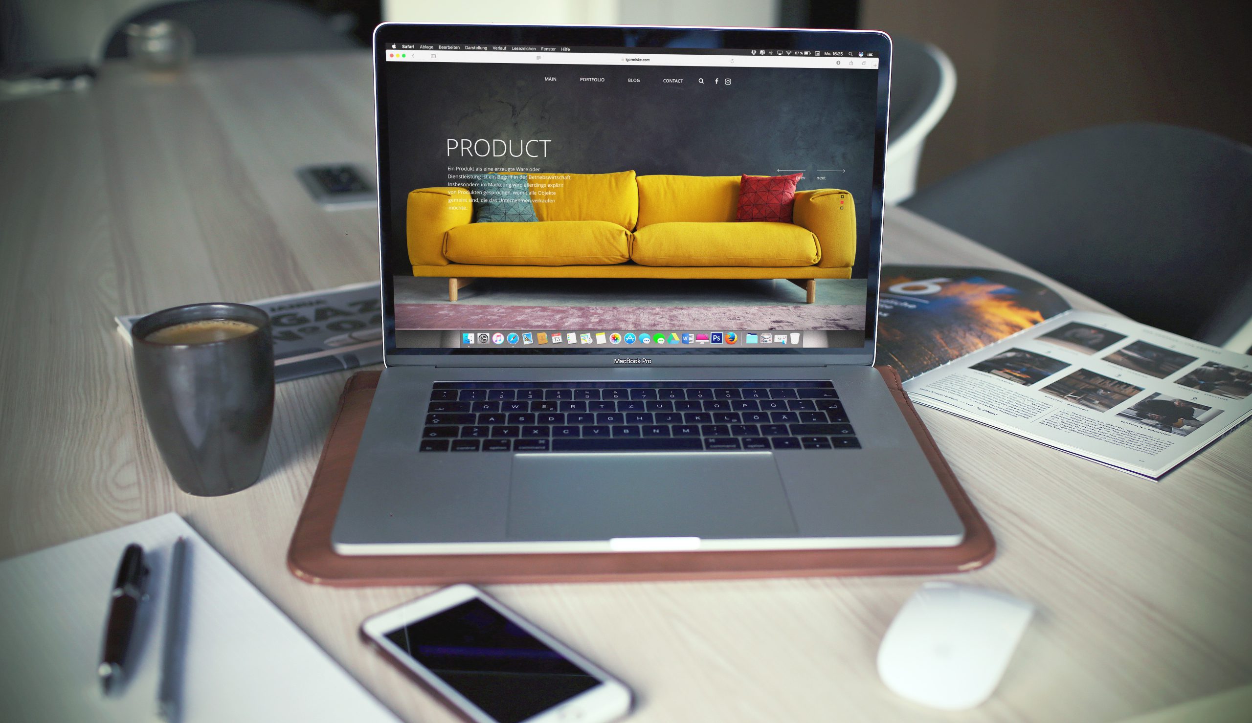 eCommerce website displayed on a laptop showing a yellow sofa