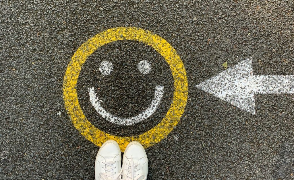 Smiley face painted on the pavement