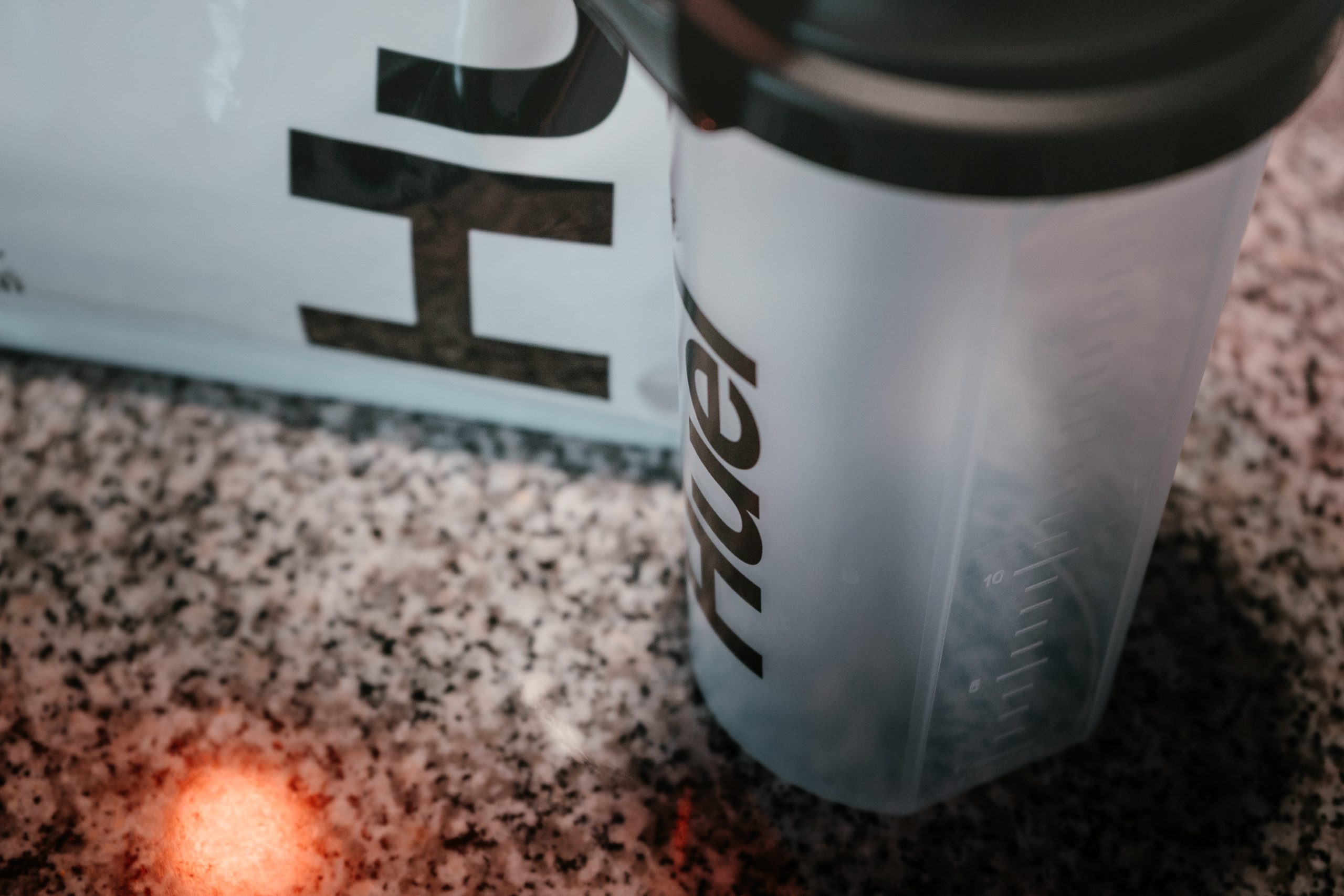 close up of enterprise brand Huel protein powder and shaker on a counter