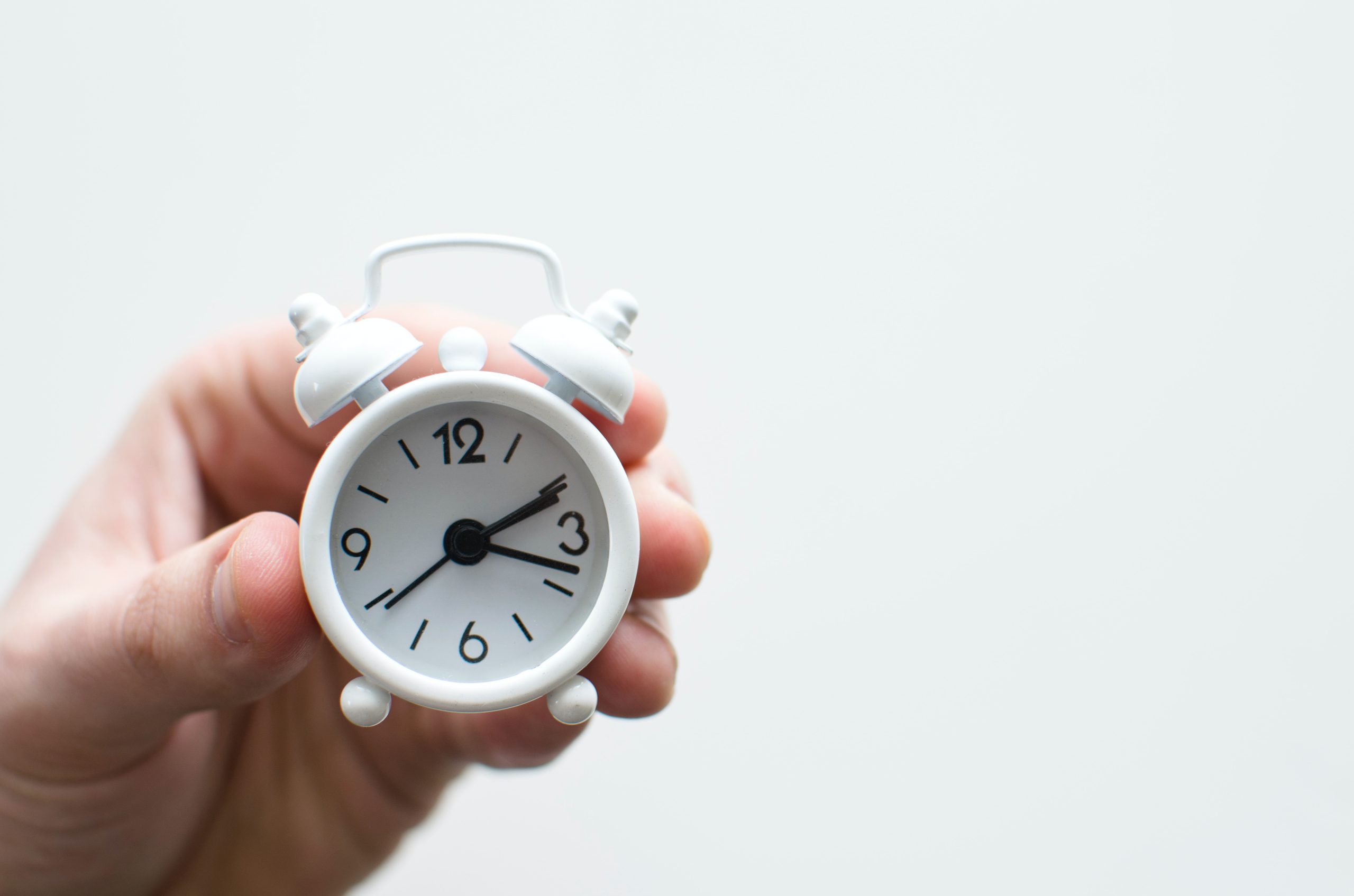 small white alarm clock