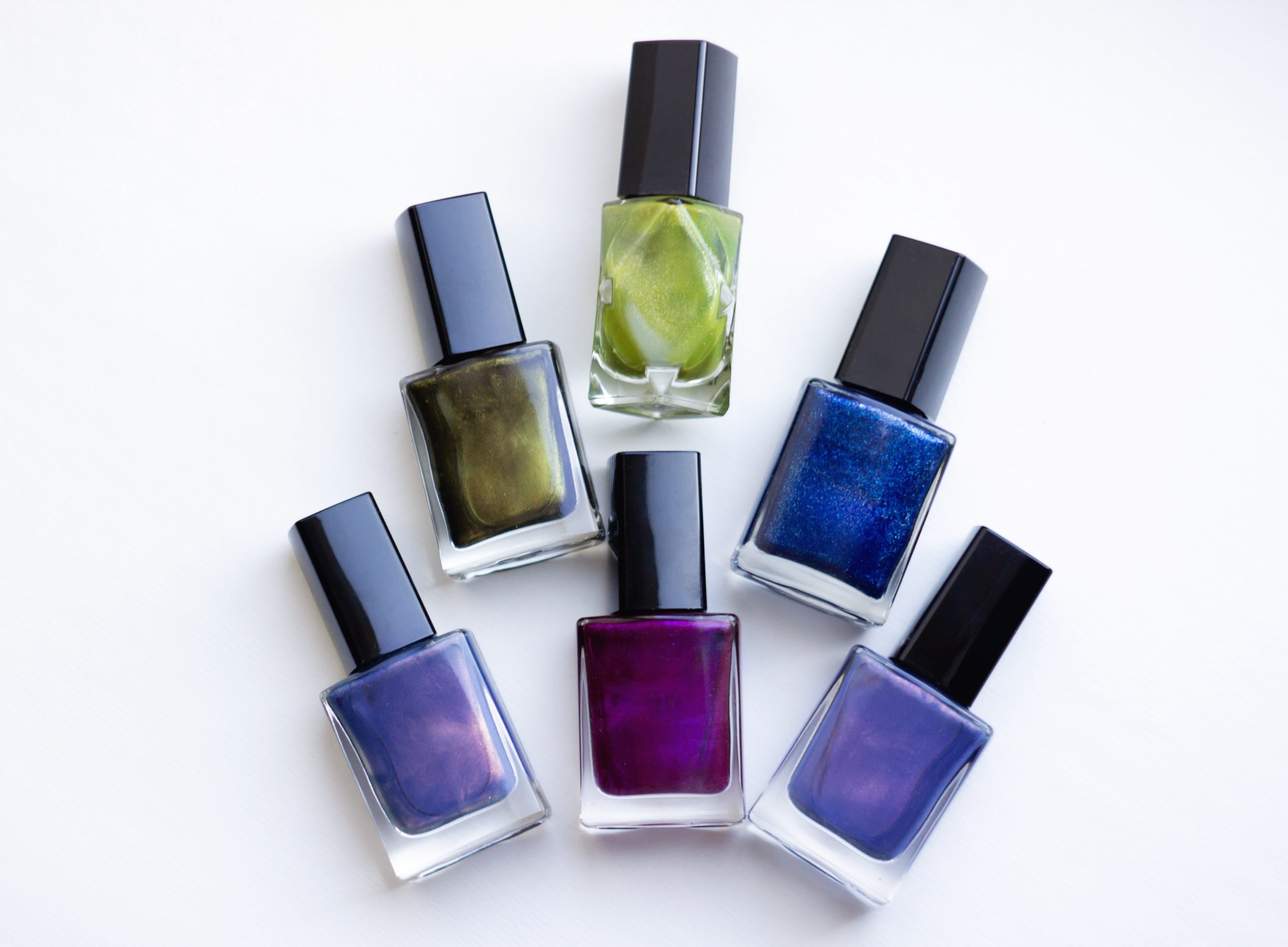 Selection of beauty product nail polishes against a white background