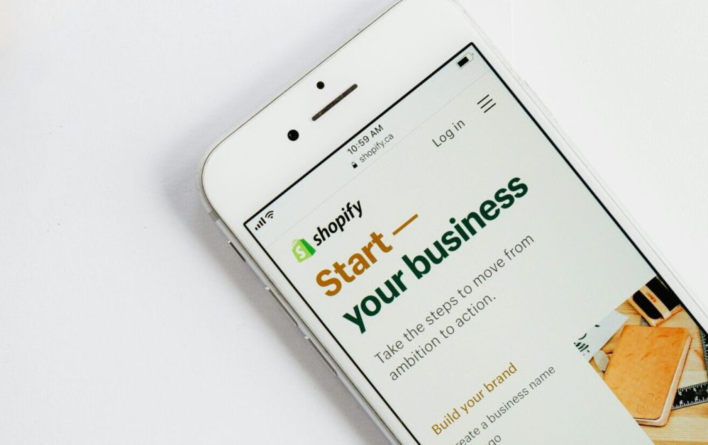 Phone that says "Start your business on Shopify"