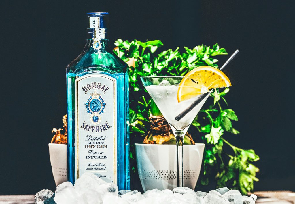 Bombay Sapphire gin bottle next to a gin glass