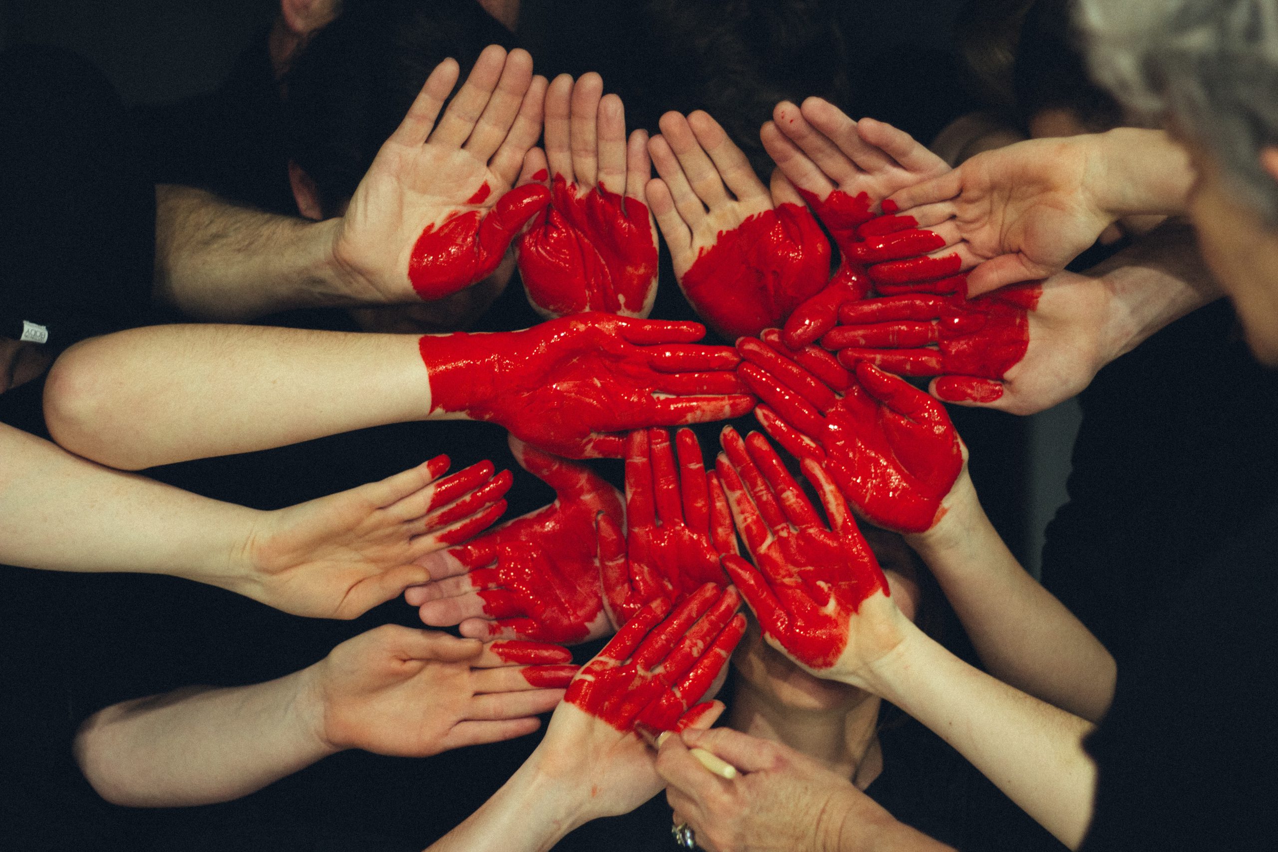 Hands with a red painted diversity heart