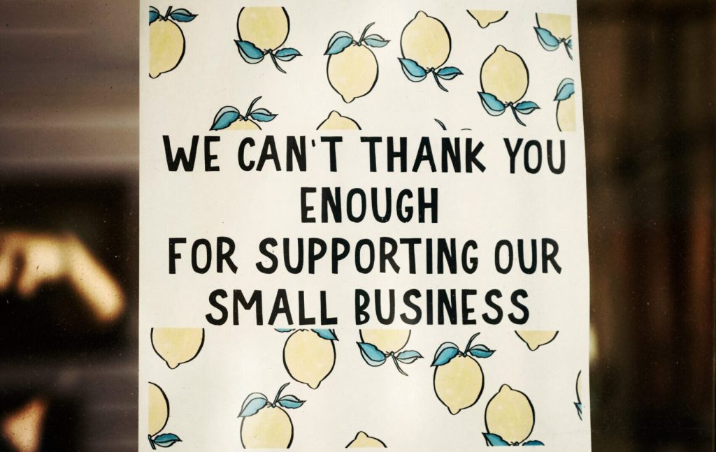 A sign with lemons that says 'thank you for supporting our small business'