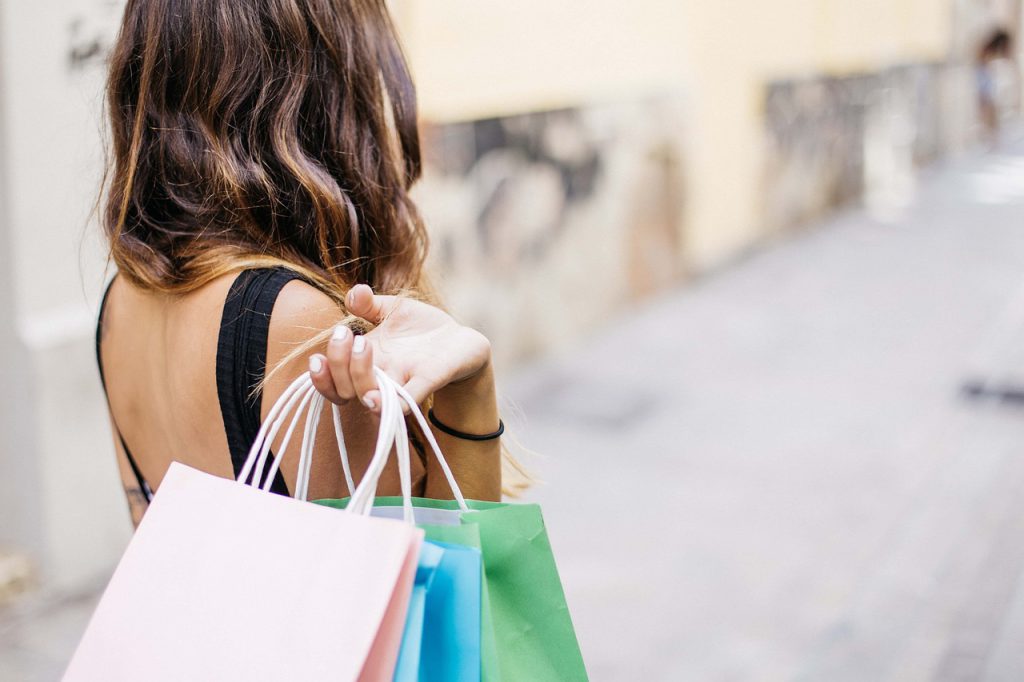 woman carrying shopping bags in the street